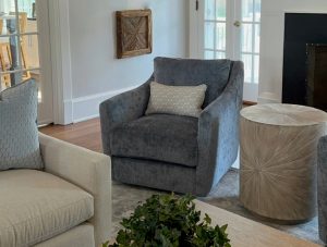 A tastefully designed living room with two stylish chairs and a sleek coffee table.