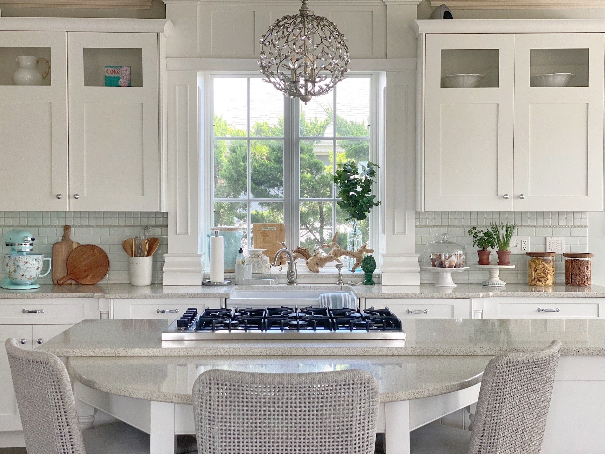 An interior design with white cabinets and a center island.