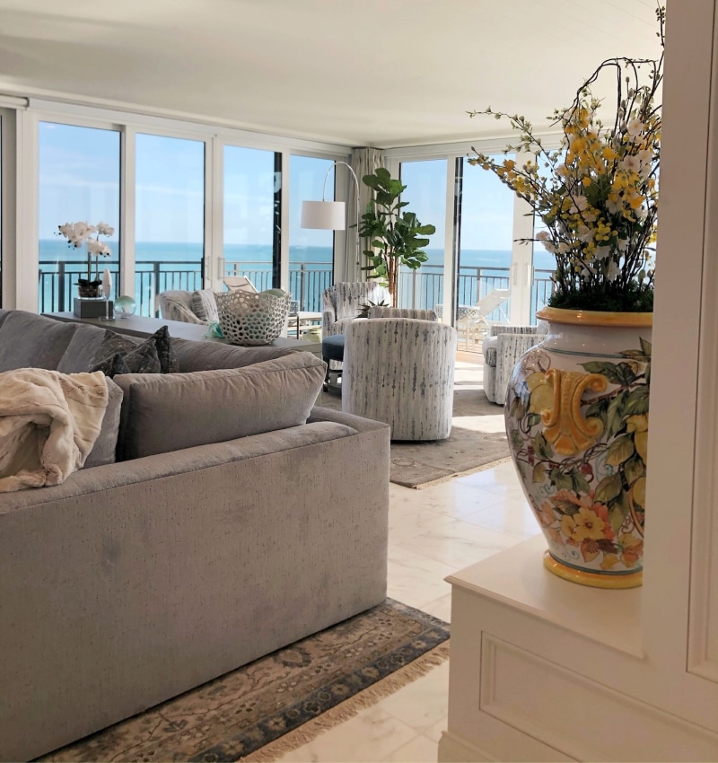 A beautifully designed living room with a breathtaking view of the ocean.
